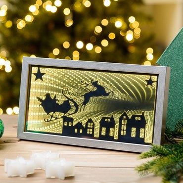 Portarretratos plateado Papá Noel sobre trineo volando, efecto Infinity Mirror, 32 x h. 17 cm, pilas y USB, led blanco cálido