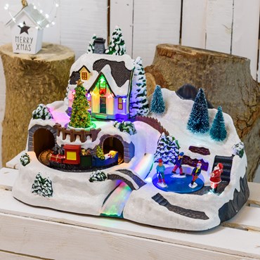 Battery operated Christmas Village, Christmas Tree, Moving Train and Ice Skaters, h 25 cm, with Christmas Music
