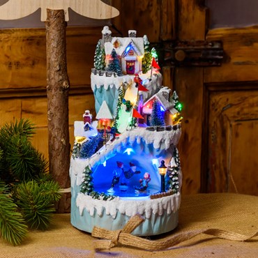 Battery operated Polyresin Christmas Village, Rotating Ice Skaters and Skiers, h 26 cm, with Christmas Music